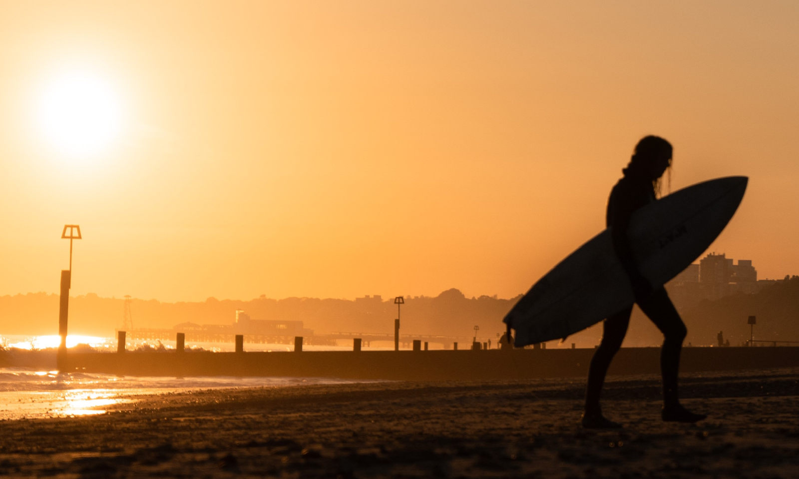 Surfing in Boscombe at sunset
